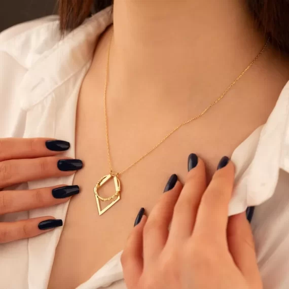 Woman wearing a necklace ring holder with her engagement ring