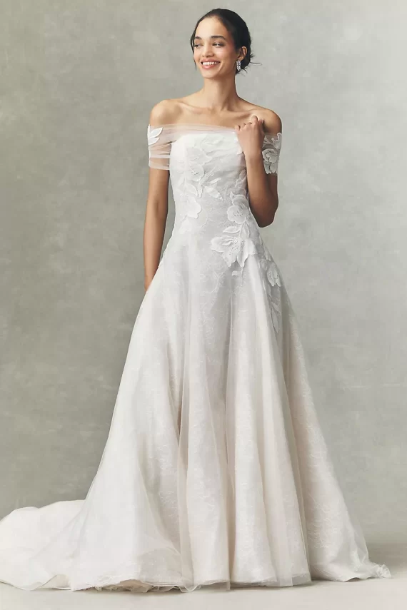 Off-the-shoulder lace applique style wedding dress with strapless neckline