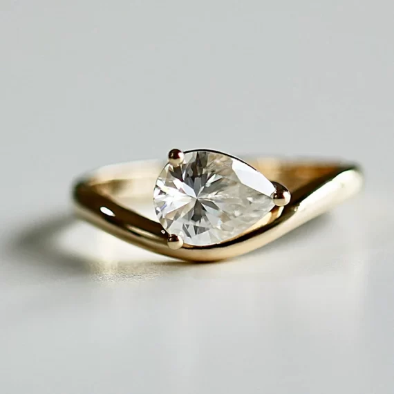 pear moissanite east-west style engagement ring