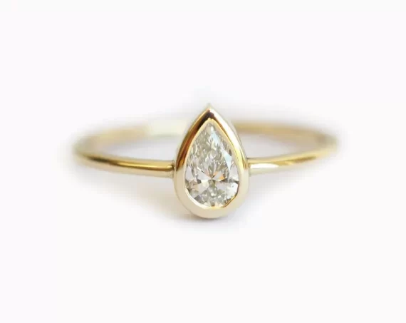 pear shaped engagement ring in yellow gold