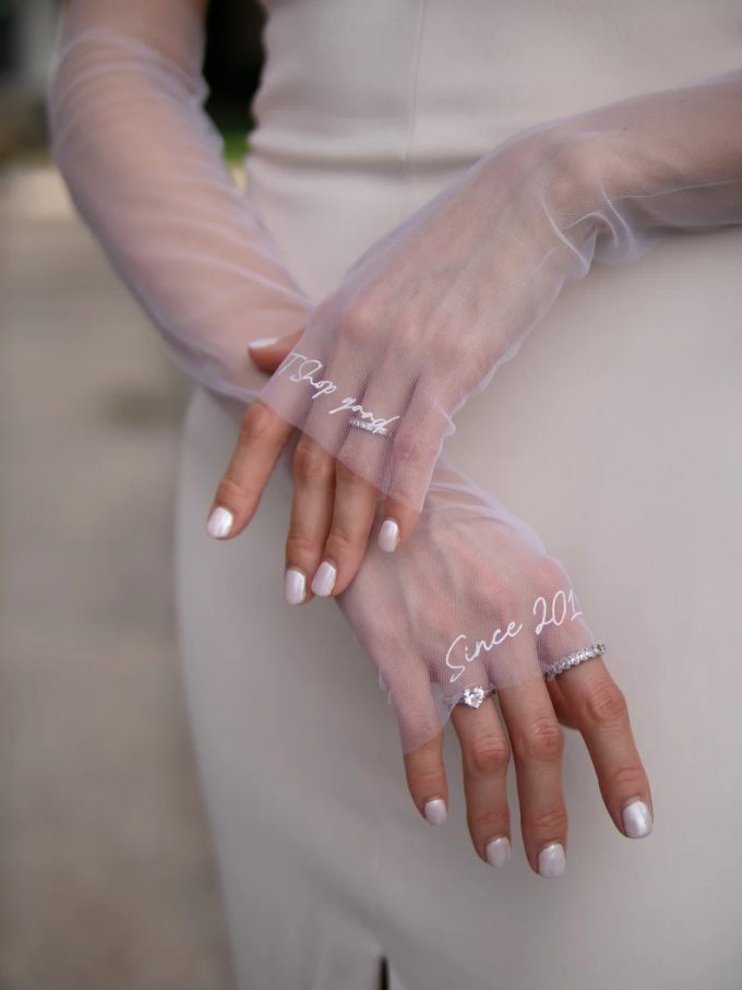 Custom bridal sleeves that are fingerless gloves but look like sleeve