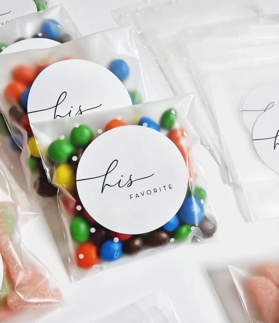 Close-up of personalized wedding favor labels for candy bags
