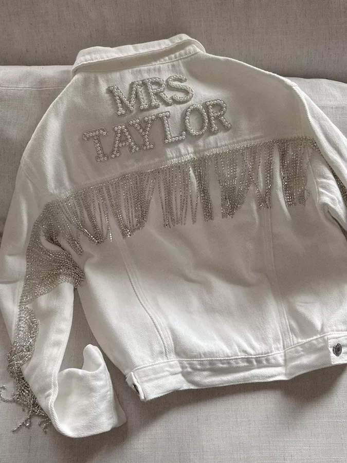 Rhinestone fringe bridal jacket adding movement and sparkle