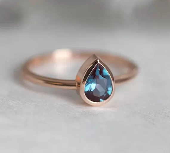 alexandrite stone engagement ring with rose shape