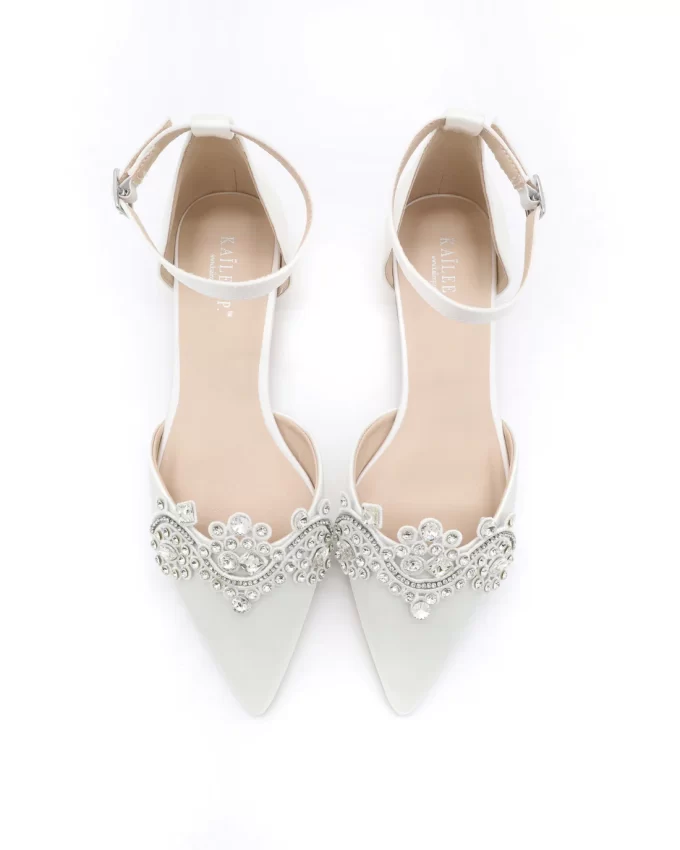 White satin flats for the bride with rhinestone detail
