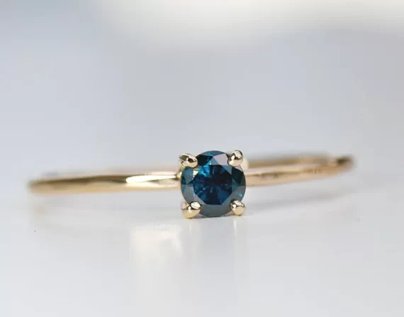 blue solitaire diamond ring