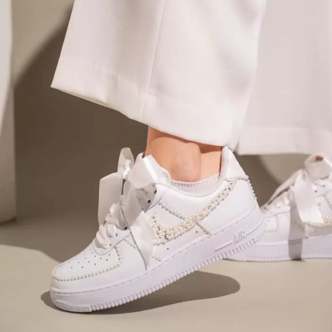 White bridal sneakers with pearl embellishments