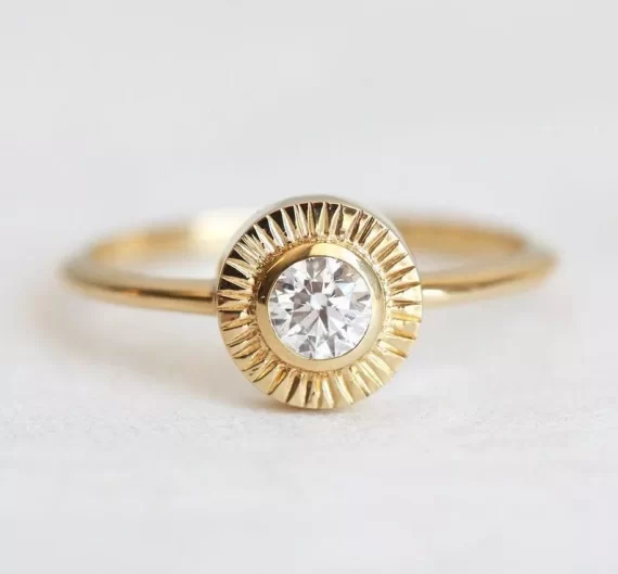 Diamond sun setting solitaire ring