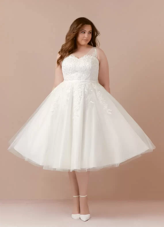 Tea-length tulle A-line reception dress hides tummy and adds volume