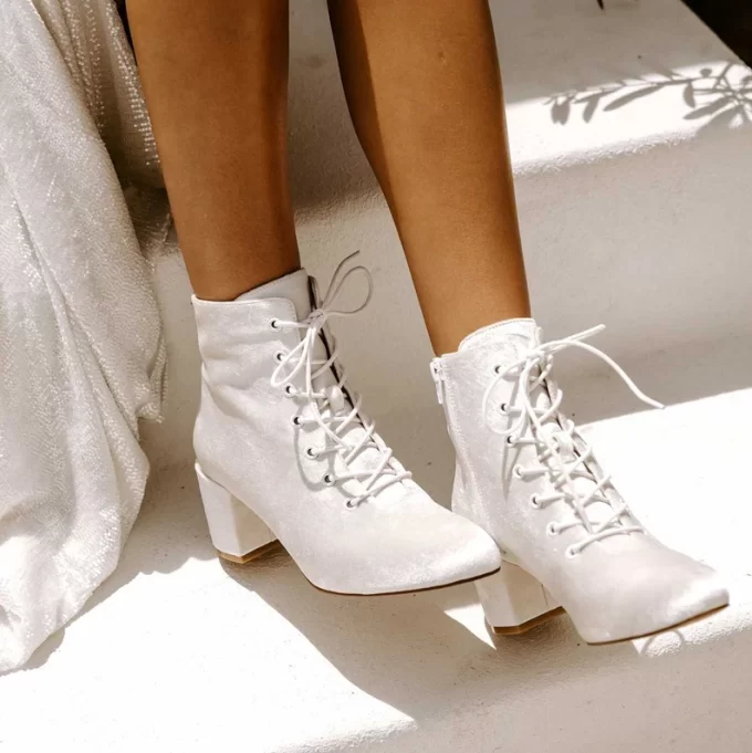 Wear velvet bridal boots to balance your look and add warmth in cooler months