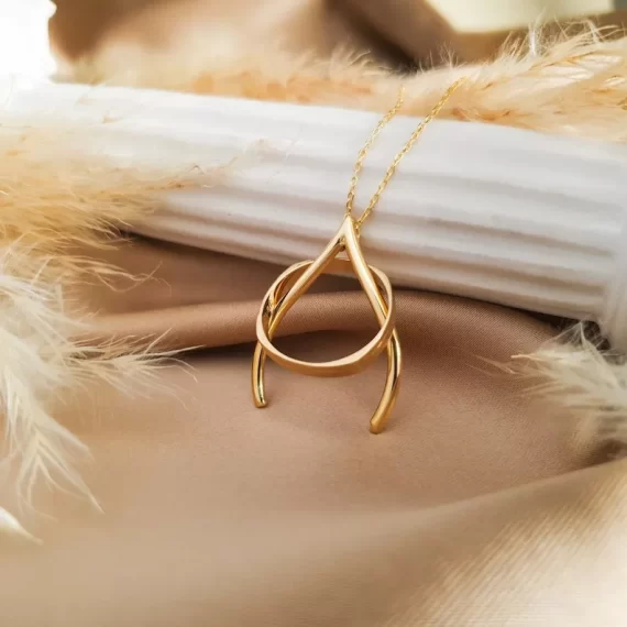 Close-up of engagement ring secured in a necklace ring holder