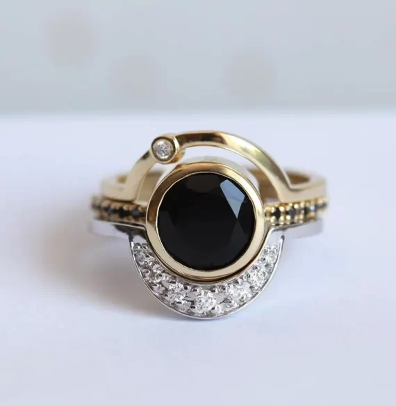 Black diamond eclipse engagement ring set with curved gold band