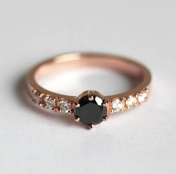 Minimalist black diamond solitaire engagement ring on gold band