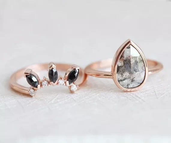 Gray diamond engagement ring with black diamond wedding band accents