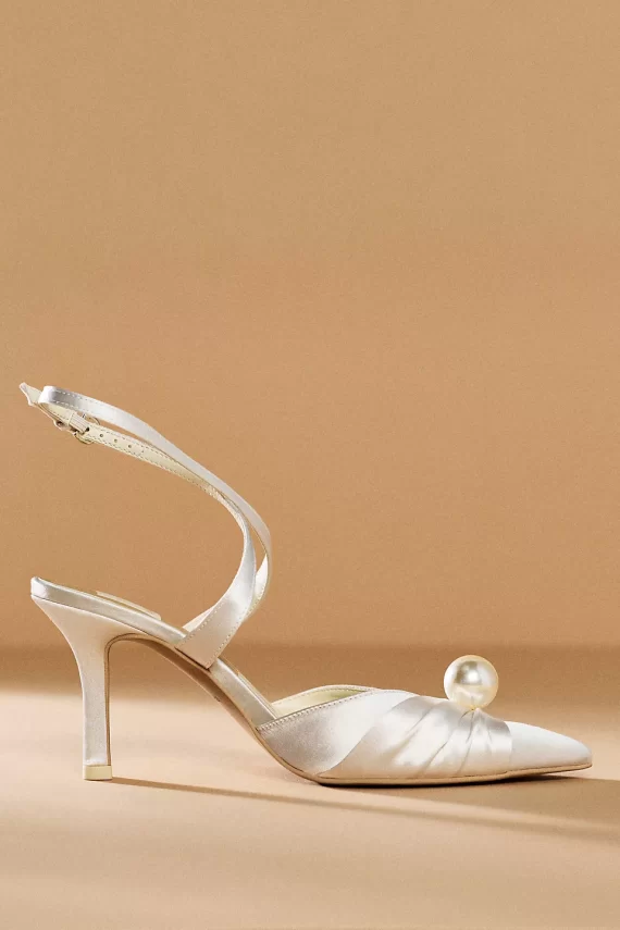 close-up of dolce vita wedding footwear with pearl on top