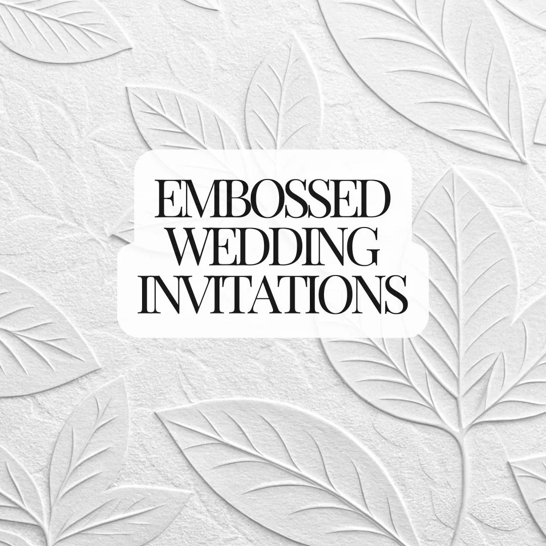 embossed wedding invitations with raised floral design on handmade cotton paper