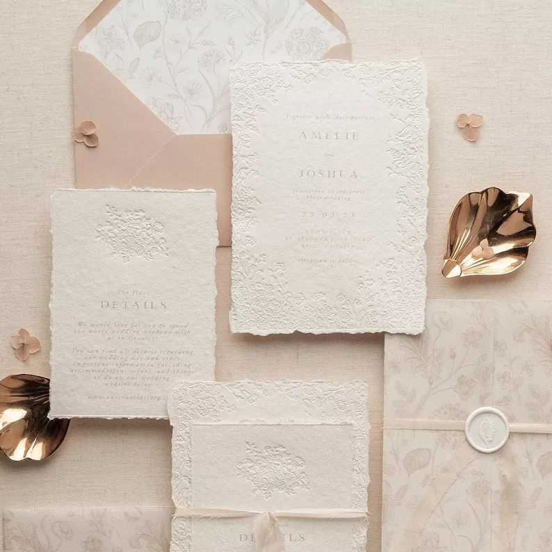 Embossed wildflower wedding invitation on handmade cotton paper