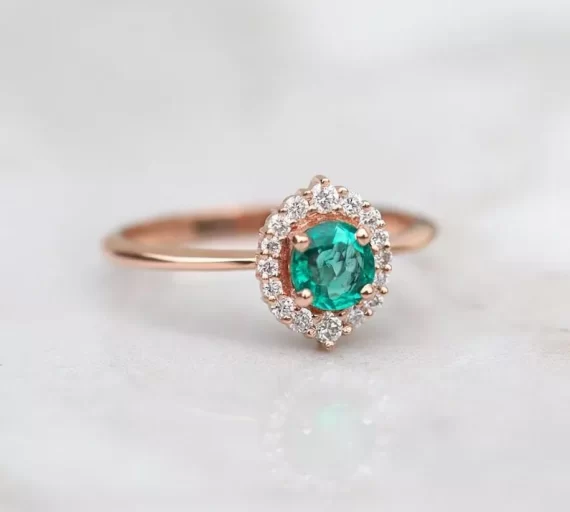Emerald engagement ring with vintage-inspired setting