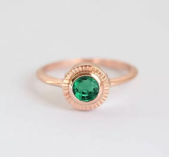 solitaire engagement ring with emerald stone