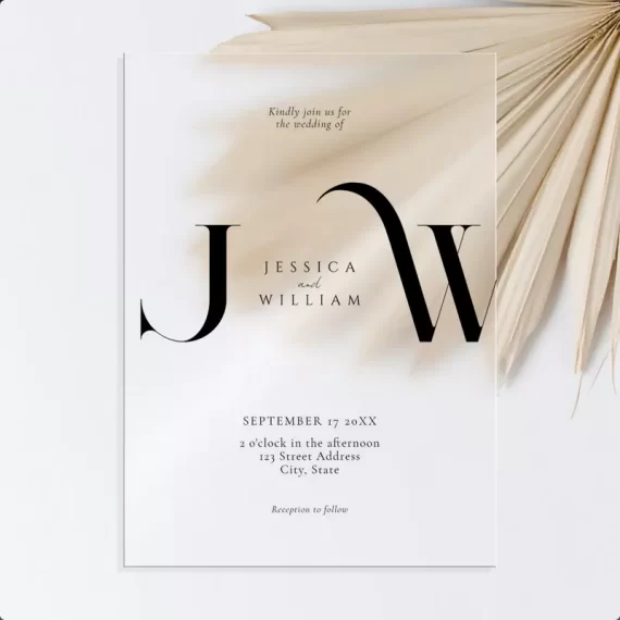 Frosted acrylic wedding invitation with monogram design and black lettering