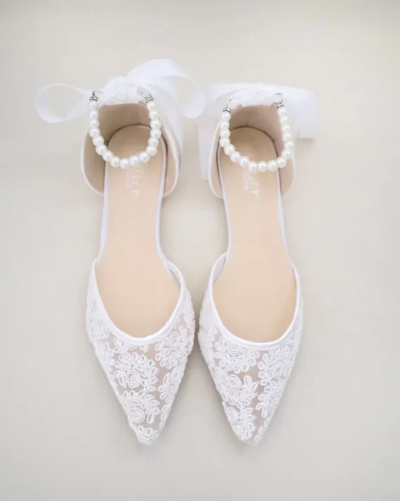 Matching your lace wedding dress with ivory flats in lace with pearl ankle straps