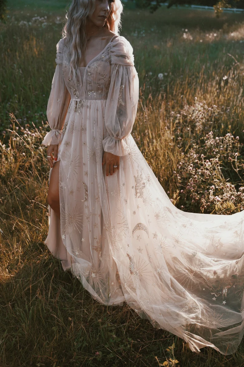 embroidered non traditional wedding dress with elegant sleeves and celestial details