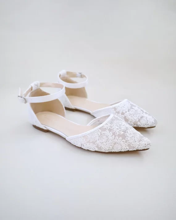 Pair of comfortable lace flats wedding shoes at outdoor wedding venue