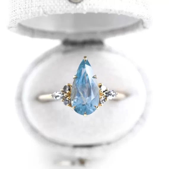 sapphire engagement ring with pastel blue stone in pear shape