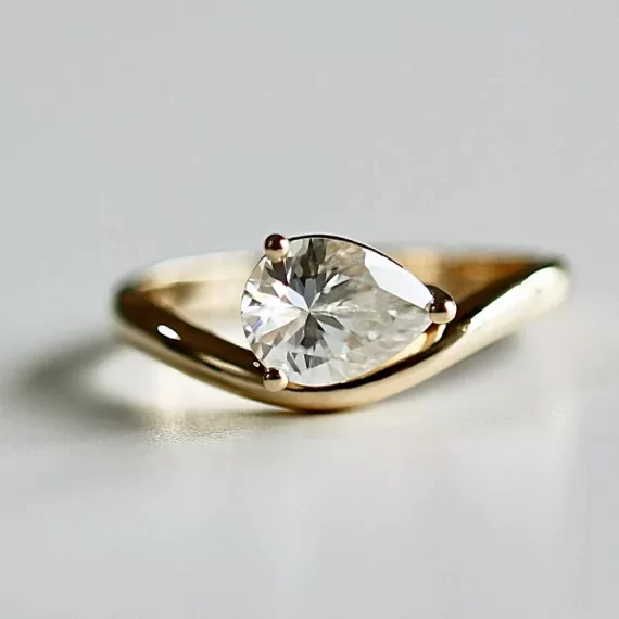 Moissanite engagement ring as diamond alternative sparkle in pear shaped setting