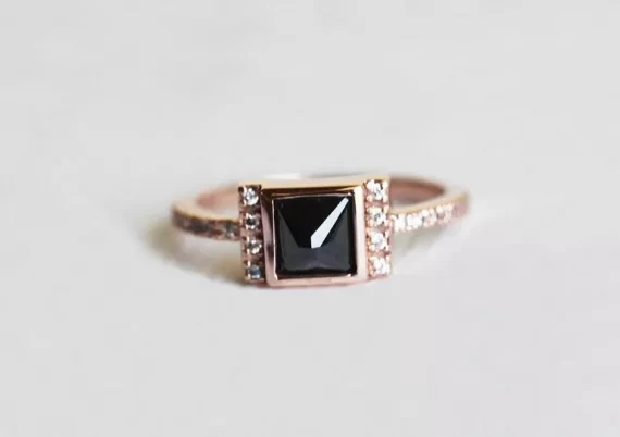 Princess cut black diamond engagement ring with white diamond accents