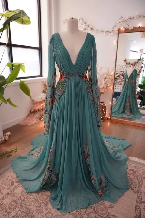 teal embroidered alternative wedding dress with sleeves and floral detailing