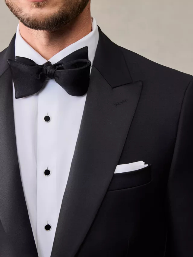 Close-up of tuxedo lapel and buttons - wedding suits groom and groomsmen