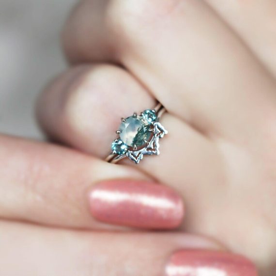 Unique non-diamond engagement ring worn during an engagement proposal