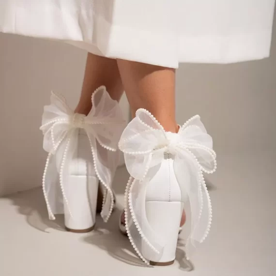 white bridal block heels with bow on back