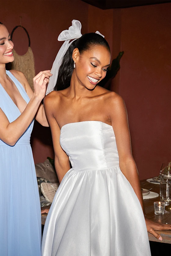 bride wearing a hair bow instead of a veil