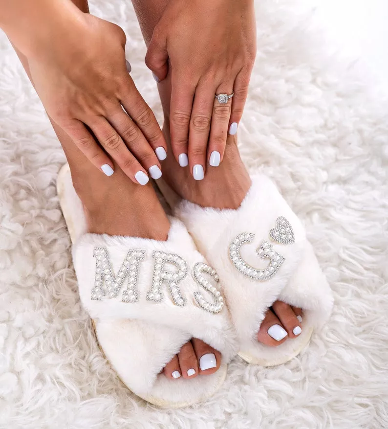 Bride wearing cozy getting-ready slippers, perfect for wedding morning prep and matching bridesmaid robes