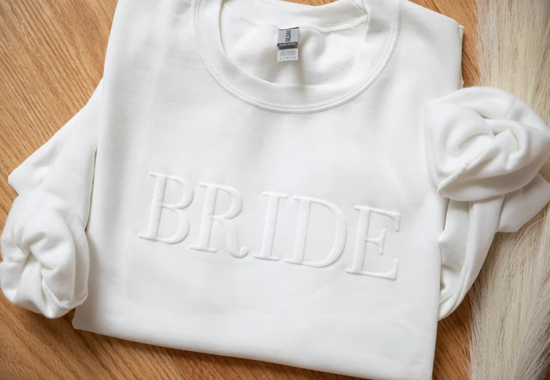 flaylay of bride sweatshirt with embossing