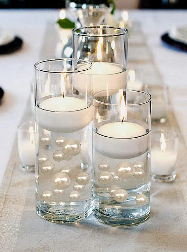 Candle wedding centerpieces without flowers using floating candles and votives