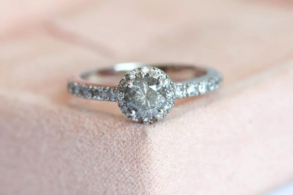 Capucinne jewelry review hero image featuring 14k gold engagement ring and minimalist wedding band