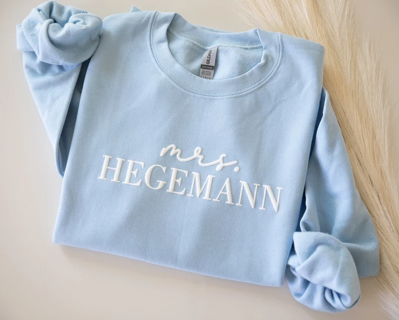 custom blue mrs sweatshirt with new last name and date on sleeve
