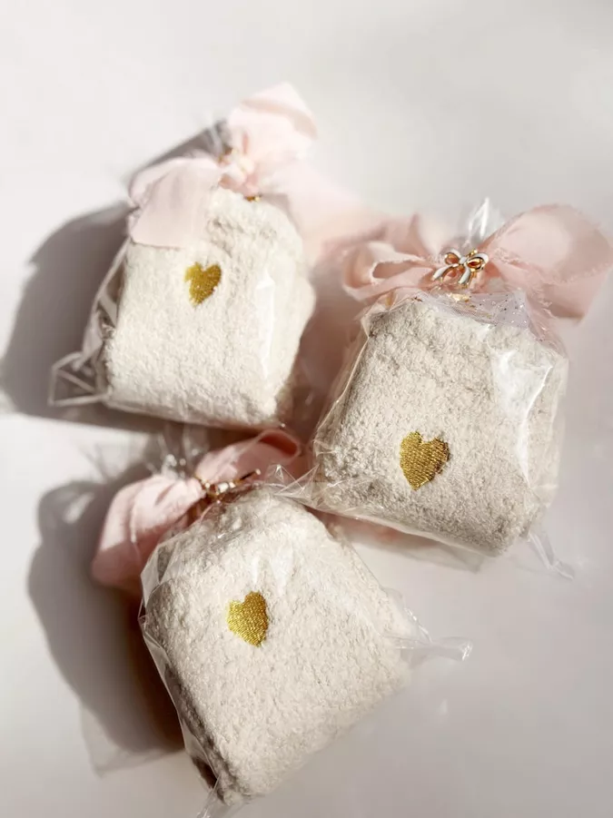 Cute fuzzy socks as a Galentine’s Day gift in gold heart pattern