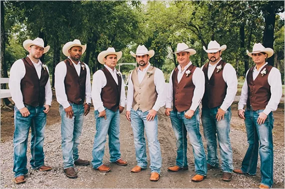 groomsmen in jeans and vests with cowboy hats as non-suit groomsman attire