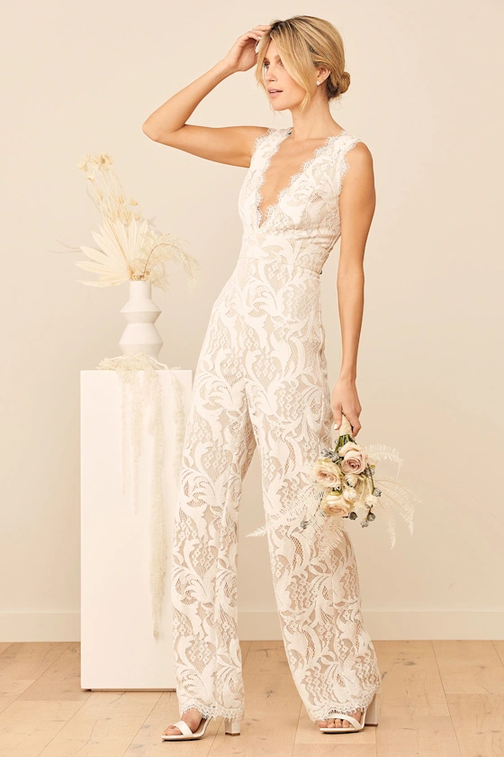 Romantic bridal jumpsuit with lace bodice and soft overlay for garden or intimate weddings