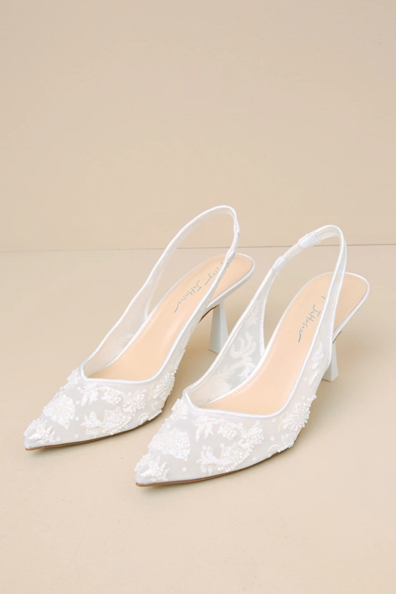 Ivory lace pumps with slingback and kitten heel