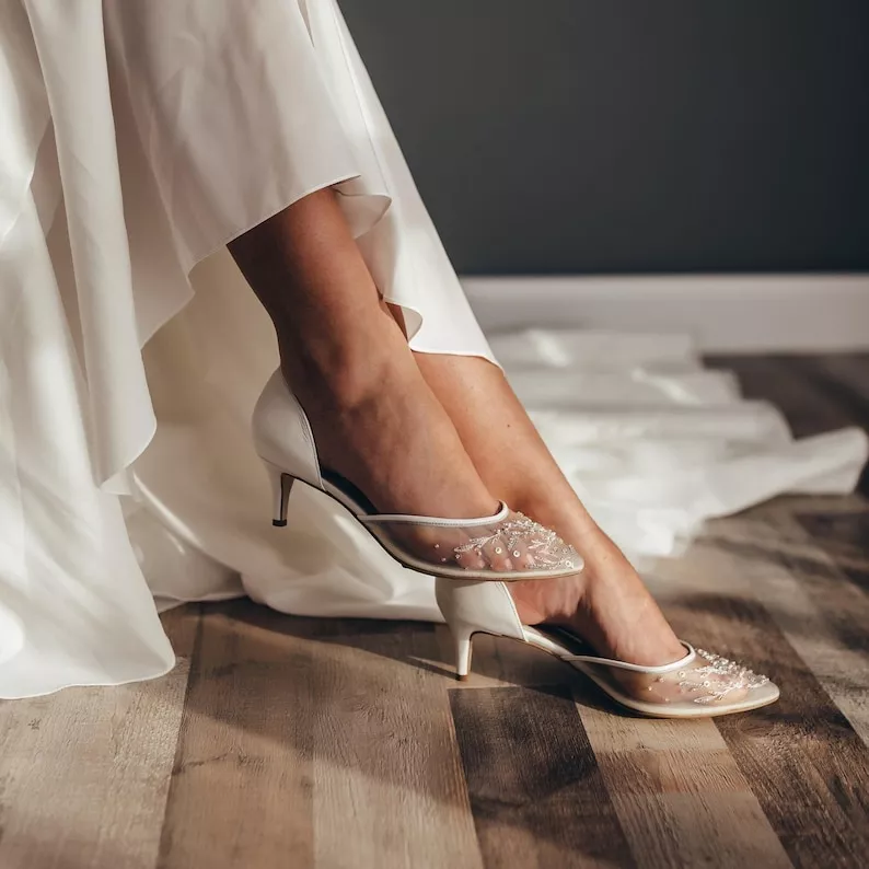 Elegant mesh d'orsay satin kitten heel pumps worn by bride