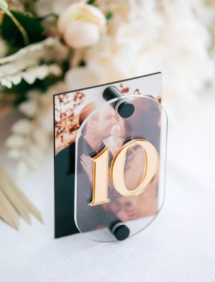 Playful wedding table numbers with photos and numbers on reception tables