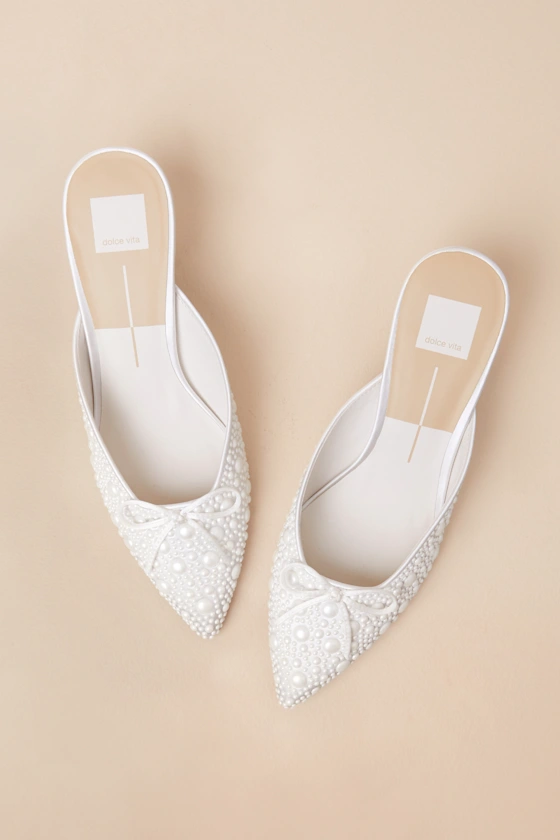 Pearl-embellished kitten heels styled with a bridal gown for a wedding day