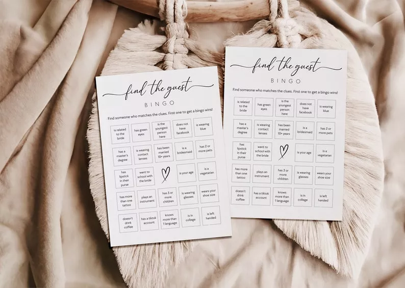 Modern bridal shower bingo printable cards displayed on a styled party table