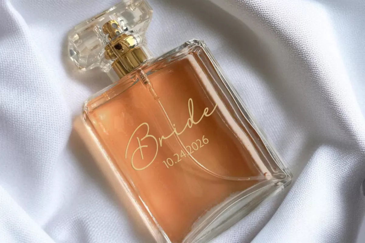 Close-up of engraved bride perfume bottle personalization, custom wedding gift keepsake