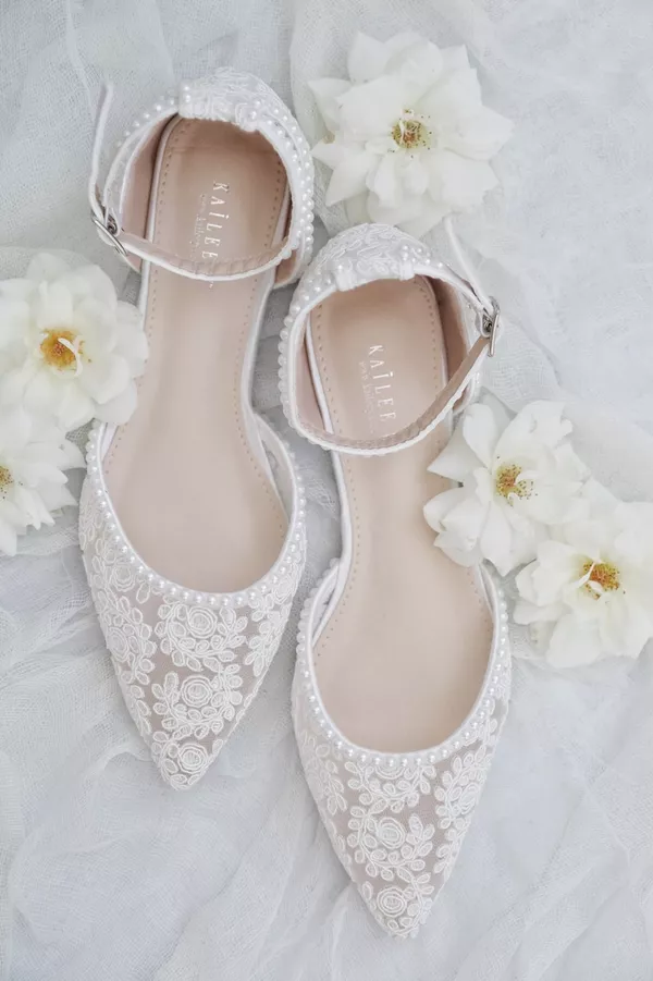 Bride wearing comfortable bridal flats for outdoor wedding